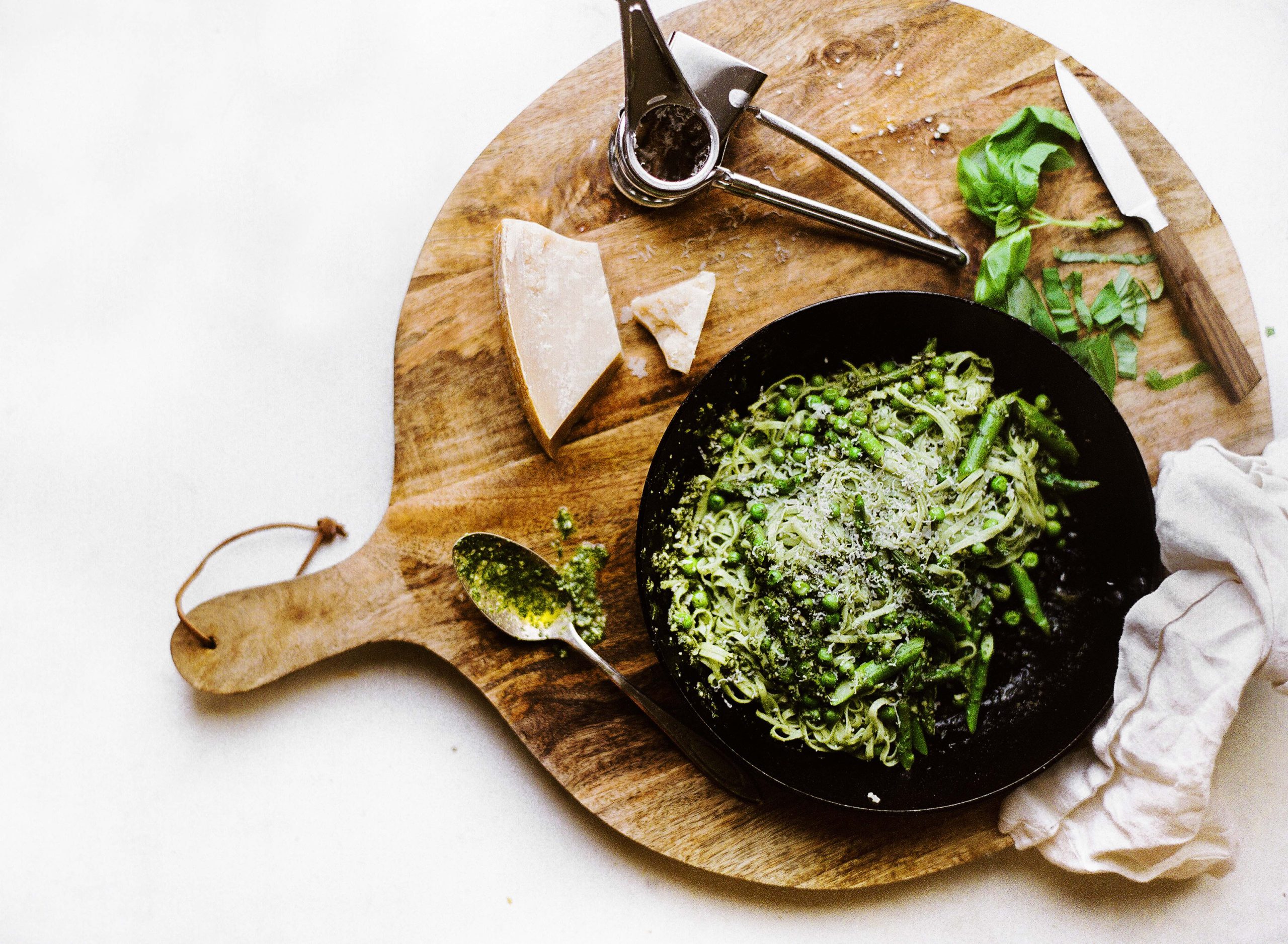 Spinach Noodle Pasta with Fresh Asparagus, Peas, Pesto and Parmesan Cheese