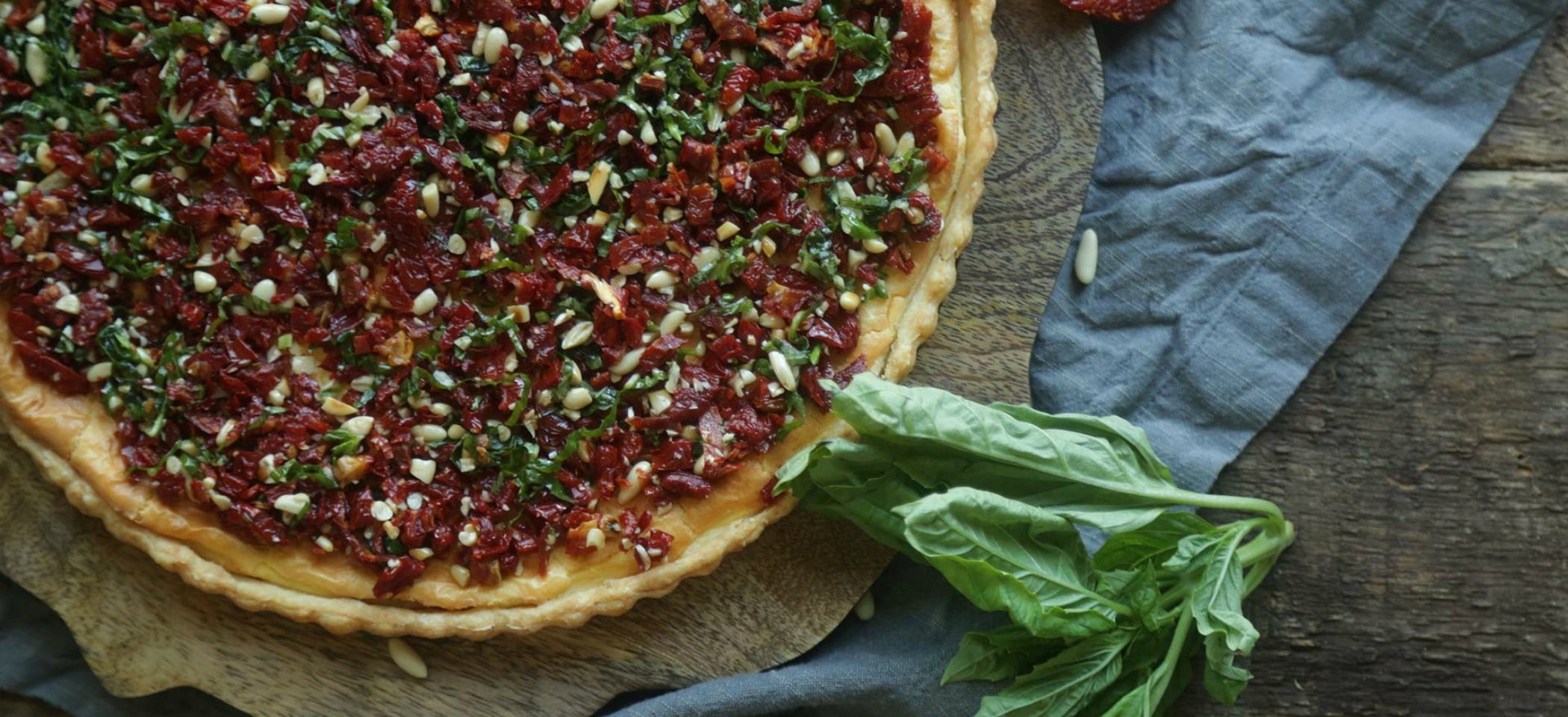 Goat Cheese Tart with Sundried Tomatoes, Pine Nuts + Basil