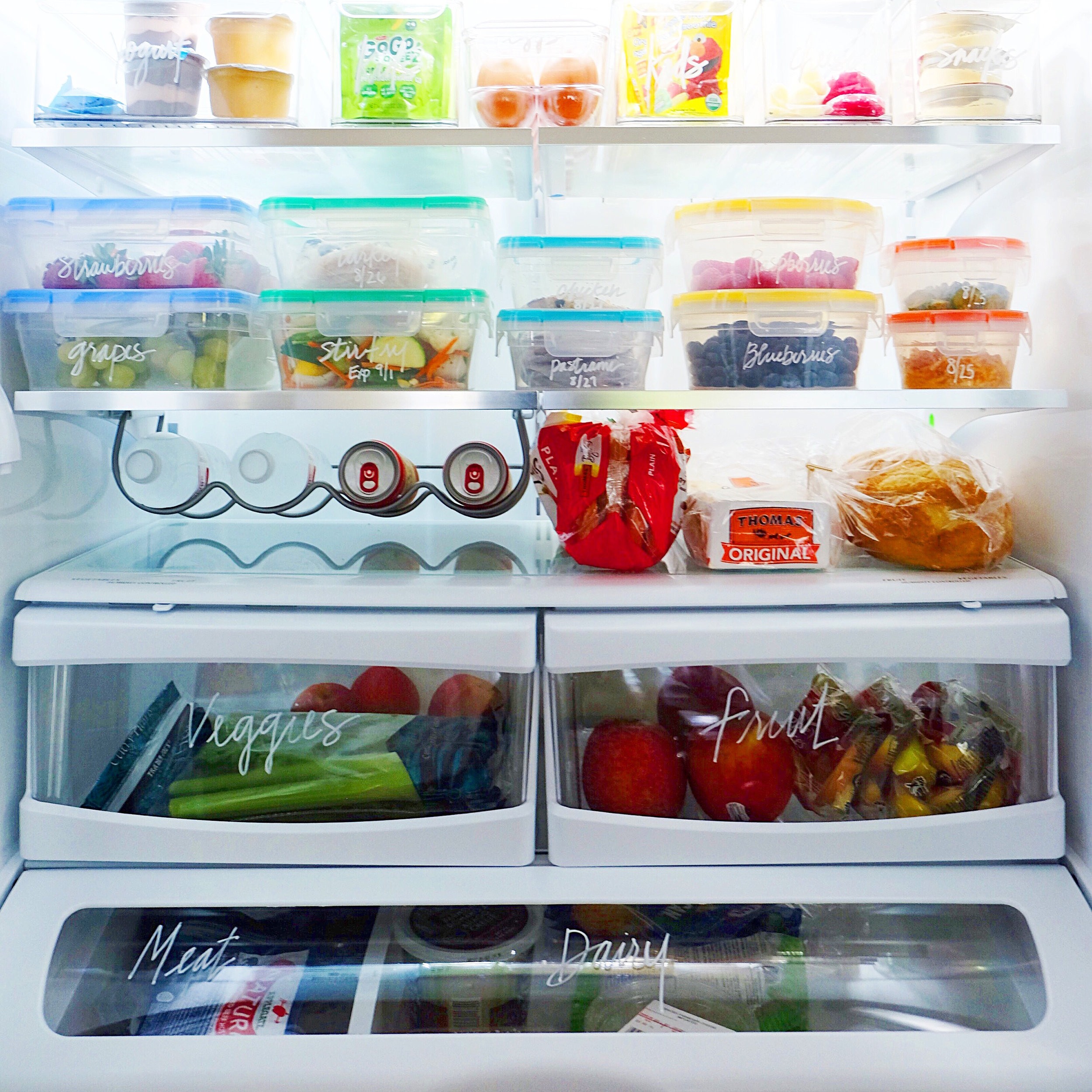 Beautiful, clean and organized fridge with wood and glass storage